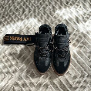 IVY PARK Black and Gold High-Top Sneakers
